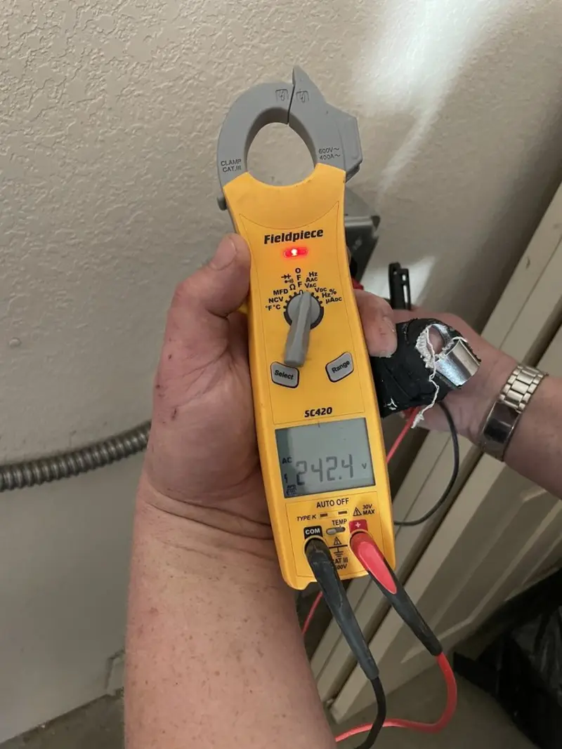 Voltage testing with clamp meter during Ceiling Fan Installation in Braidwood